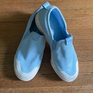 Baby blue slip on adidas sneakers